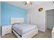 This modern bedroom has a padded headboard, matching nightstand, and neutral color scheme at 5220 Red Coral Cir, Mount Dora, FL 32757