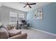 Home office/bedroom with neutral paint and cozy furniture for a productive workspace at 5220 Red Coral Cir, Mount Dora, FL 32757