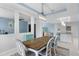 Elegant dining area with modern lighting and an open floor plan for easy entertaining at 5220 Red Coral Cir, Mount Dora, FL 32757