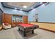 Inviting game room with a pool table, comfortable seating, and ample lighting for entertainment at 5220 Red Coral Cir, Mount Dora, FL 32757