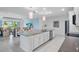 Bright, open kitchen with a large island and stainless steel appliances is perfect for entertaining guests at 5220 Red Coral Cir, Mount Dora, FL 32757