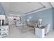 Open concept living room and kitchen with tile floors and neutral color palette at 5220 Red Coral Cir, Mount Dora, FL 32757