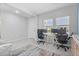 Home office showcases two workstations, neutral decor, and abundant natural light at 5220 Red Coral Cir, Mount Dora, FL 32757