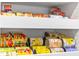 Close-up of pantry shelves filled with canned goods in an organized arrangement at 5220 Red Coral Cir, Mount Dora, FL 32757