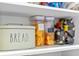 Neatly arranged pantry shelves with bread container and storage jars displayed at 5220 Red Coral Cir, Mount Dora, FL 32757