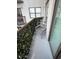 Relax on this beautiful balcony with chairs and decorative privacy greenery for your enjoyment at 6165 Carrier Dr # 1801, Orlando, FL 32819