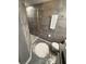This bathroom includes tiled walls, a glass enclosed shower, and tiled flooring at 6165 Carrier Dr # 1801, Orlando, FL 32819