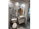 The bathroom offers a unique design with colorful tiling around the vanity and sink at 6165 Carrier Dr # 1801, Orlando, FL 32819