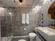 Modern bathroom featuring elegant fixtures, tiled shower, and decorative accents at 6165 Carrier Dr # 1801, Orlando, FL 32819