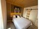 This unique bedroom offers a comfortable bed and a eye catching tiger wall decor at 6165 Carrier Dr # 1801, Orlando, FL 32819