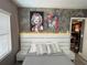 Beautiful bedroom with a modern headboard with lighting and stylish decorations at 6165 Carrier Dr # 1801, Orlando, FL 32819