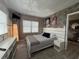 Stylish bedroom with neutral color scheme, featuring a queen-size bed, modern decor, and an abundance of natural light at 6165 Carrier Dr # 1801, Orlando, FL 32819