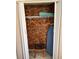 View of closet with clothes hangers, an ironing board and a small stool at 6165 Carrier Dr # 1801, Orlando, FL 32819