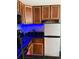 Features wooden cabinetry and stainless steel appliances with under cabinet lighting at 6165 Carrier Dr # 1801, Orlando, FL 32819