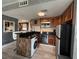 Well-equipped kitchen featuring dark countertops and modern appliances at 6165 Carrier Dr # 1801, Orlando, FL 32819