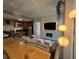 Spacious living room with modern finishes and a view into the adjacent kitchen at 6165 Carrier Dr # 1801, Orlando, FL 32819
