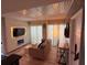 Open-concept living room with sleek floors, modern fireplace, and stylish furniture, ideal for comfortable living at 6165 Carrier Dr # 1801, Orlando, FL 32819