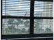 Features a view out the window of surrounding areas, trees, and buildings at 6165 Carrier Dr # 1801, Orlando, FL 32819