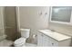 This bathroom features a walk-in shower, a toilet and a vanity with a mirror at 6451 Old Park Ln # 407, Orlando, FL 32835