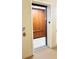 Convenient access with this building elevator, featuring a modern wood panel interior at 6451 Old Park Ln # 407, Orlando, FL 32835