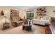 Cozy bonus room featuring comfortable seating, neutral decor, and access to a screened porch at 6460 Parson Brown Dr, Orlando, FL 32819