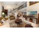 Open living room featuring a staircase, high ceilings, comfortable seating, and unique wooden furniture at 6460 Parson Brown Dr, Orlando, FL 32819