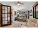 Inviting living room with comfortable seating, ceiling fans, and natural light, creating a cozy atmosphere at 6460 Parson Brown Dr, Orlando, FL 32819