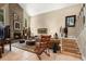 Inviting living room with a brick fireplace, neutral decor, and cozy furnishings at 6460 Parson Brown Dr, Orlando, FL 32819
