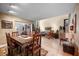 Open-concept living space featuring a dining area, living room, and staircase with stylish furnishings at 6460 Parson Brown Dr, Orlando, FL 32819