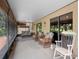 Spacious screened porch with comfortable seating, offering a peaceful outdoor living space at 6460 Parson Brown Dr, Orlando, FL 32819
