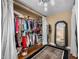 Spacious walk-in closet with ample storage, fashionable clothing, and a full-length mirror at 6460 Parson Brown Dr, Orlando, FL 32819