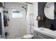 Updated bathroom with a decorative shower curtain, modern vanity, and stylish fixtures at 655 N Arnold Ave, Groveland, FL 34736