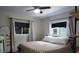 Relaxing bedroom with natural light, stylish bed, and modern curtains at 655 N Arnold Ave, Groveland, FL 34736