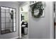 Hallway with stylish decorations providing a glimpse into the living room, enhancing the home's aesthetic at 655 N Arnold Ave, Groveland, FL 34736