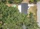 Aerial image showcases roof and patio plus mature landscaping, and convenient driveway at 7375 Lake Dr, Sanford, FL 32771