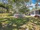 Backyard view featuring an above-ground pool and screened-in porch, perfect for enjoying the outdoors at 7375 Lake Dr, Sanford, FL 32771