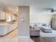 Open-concept layout showcasing a living room connected to a kitchen with white cabinets at 7375 Lake Dr, Sanford, FL 32771