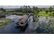 Aerial view showcasing a private boat dock with boat lift on a beautiful lake at 7550 John Hancock Dr, Winter Garden, FL 34787