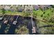 Aerial view of lakefront homes featuring pools, docks, and lush landscaping at 7550 John Hancock Dr, Winter Garden, FL 34787