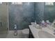 Powder room with elegant wallpaper, modern fixtures, toilet, and vanity with countertop at 7550 John Hancock Dr, Winter Garden, FL 34787