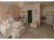 Charming bedroom with vanity, ensuite bathroom, large windows, and light colored walls at 7550 John Hancock Dr, Winter Garden, FL 34787