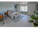 Bright bedroom with blue wainscoting, reading nook, accent lighting and light colored floors at 7550 John Hancock Dr, Winter Garden, FL 34787