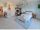Bright bedroom with blue wainscoting, reading nook, accent lighting and light colored floors at 7550 John Hancock Dr, Winter Garden, FL 34787