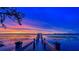 Picturesque dock extending over the water, offering access and stunning sunset views at 7550 John Hancock Dr, Winter Garden, FL 34787