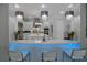 Modern kitchen featuring quartz countertop bar with blue LED accent lighting and three stylish pendant lights at 7550 John Hancock Dr, Winter Garden, FL 34787