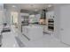 Gourmet kitchen with stainless steel appliances, a center island, and ample storage space at 7550 John Hancock Dr, Winter Garden, FL 34787