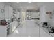 Modern kitchen featuring white cabinets, stainless steel appliances, and a center island at 7550 John Hancock Dr, Winter Garden, FL 34787