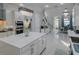 Stylish kitchen with a large center island, stainless steel appliances, and views of the dining area at 7550 John Hancock Dr, Winter Garden, FL 34787