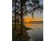 Picturesque lake view at sunset showcases the community's natural beauty at 7550 John Hancock Dr, Winter Garden, FL 34787
