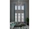 Bright living room featuring high ceilings, large windows, and stylish modern furnishings at 7550 John Hancock Dr, Winter Garden, FL 34787